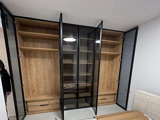 Custom oak and smoked-glass wardrobe