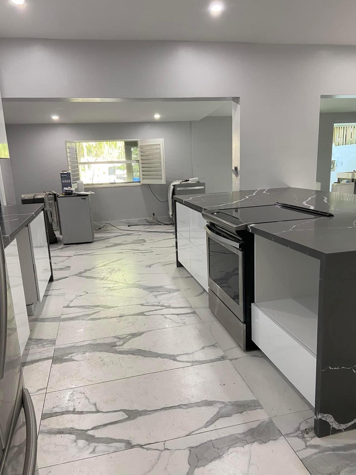 Open kitchen with calacatta marble floor and dual quartz islands